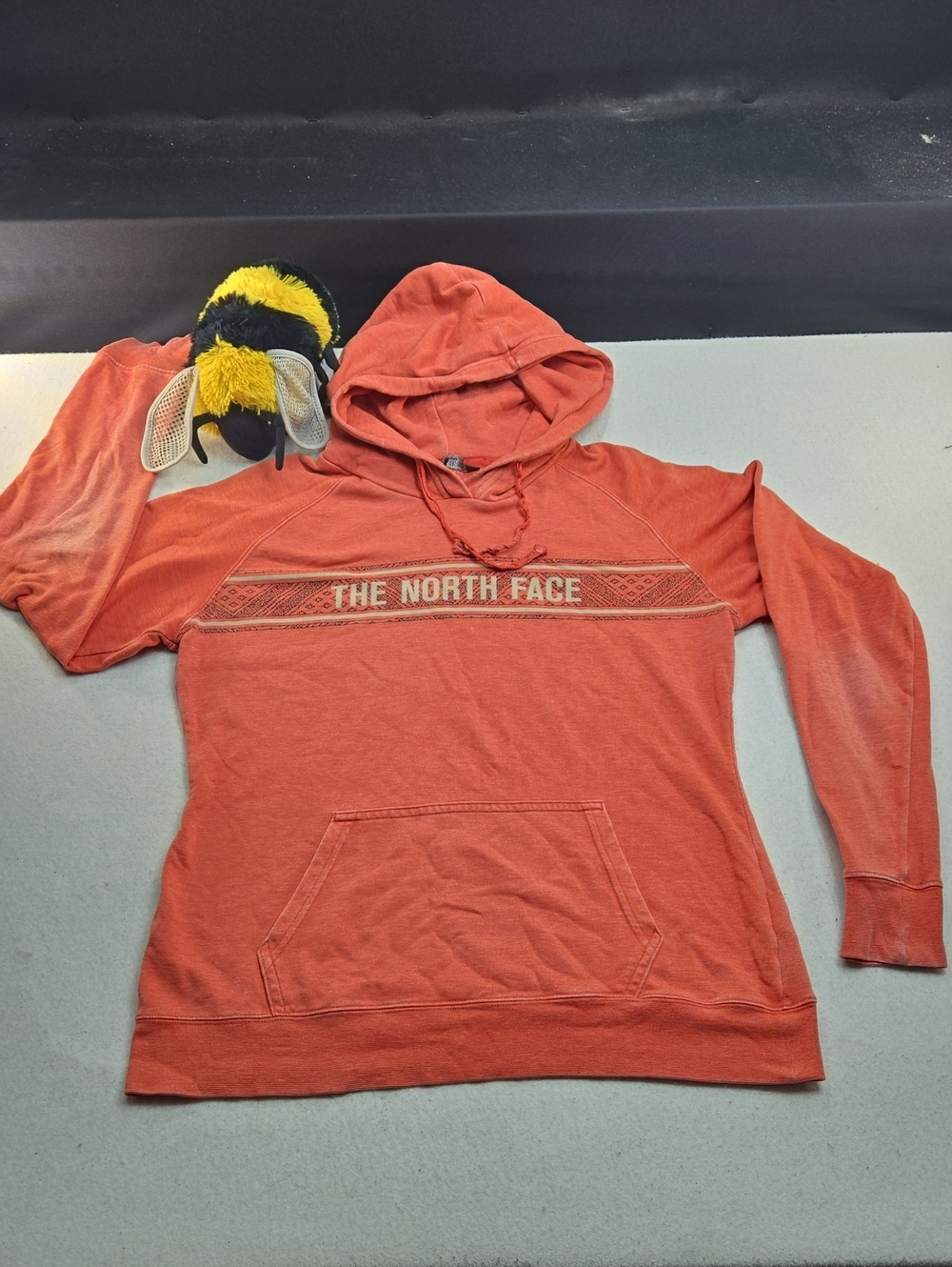 Women's The North Face tri-blend pullover hoodie in an orange/coral colorway
